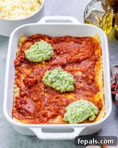 Homestyle Cottage Cheese Lasagna 11 Expertly layering the creamy cottage cheese sauce with rich marinara and tender lasagna sheets in a baking dish, building a delicious, multi-layered lasagna.