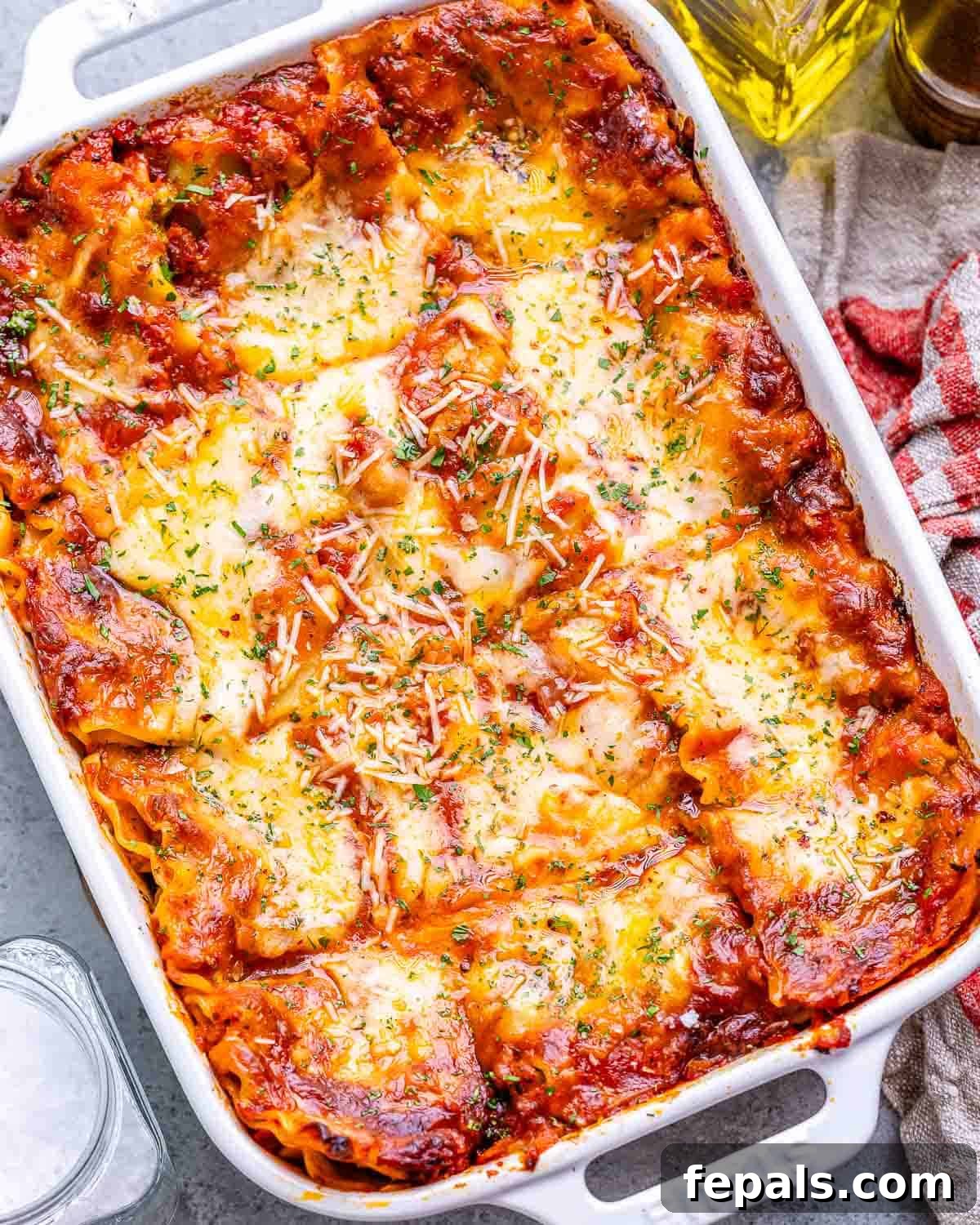 Homestyle Cottage Cheese Lasagna 13 A high-angle shot of a beautifully cooked Cottage Cheese Lasagna slice, showcasing its distinct layers of creamy spinach-cottage cheese, rich marinara, and tender pasta, ready to be enjoyed.