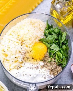 Homestyle Cottage Cheese Lasagna 10 Blending cottage cheese with egg, spinach, mozzarella, and Parmesan in a food processor, creating a creamy, bright green cheese sauce for the lasagna filling.
