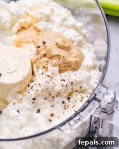 Ingredients in a food processor ready to be blended.