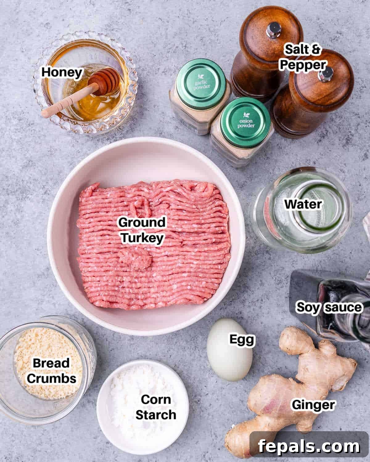 Sticky Teriyaki Turkey Meatballs 3 Ingredients laid out to make teriyaki meatballs, including ground turkey, soy sauce, honey, and fresh ginger.