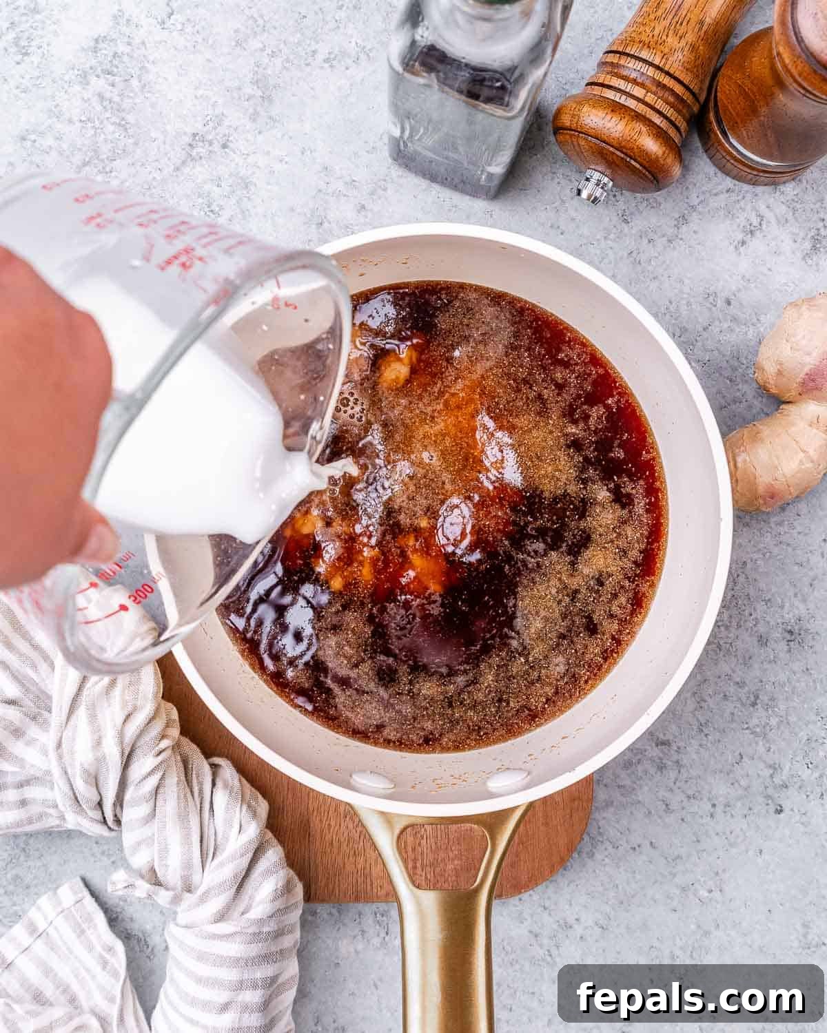 Sticky Teriyaki Turkey Meatballs 6 Preparing the teriyaki sauce: pouring liquid ingredients into a measuring cup.