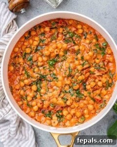 Chickpeas, spinach, and sauce combined into a creamy Tuscan-style mixture.