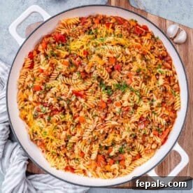 Comforting Ground Turkey Pasta 7 a skillet with tomato-based pasta made with ground turkey.