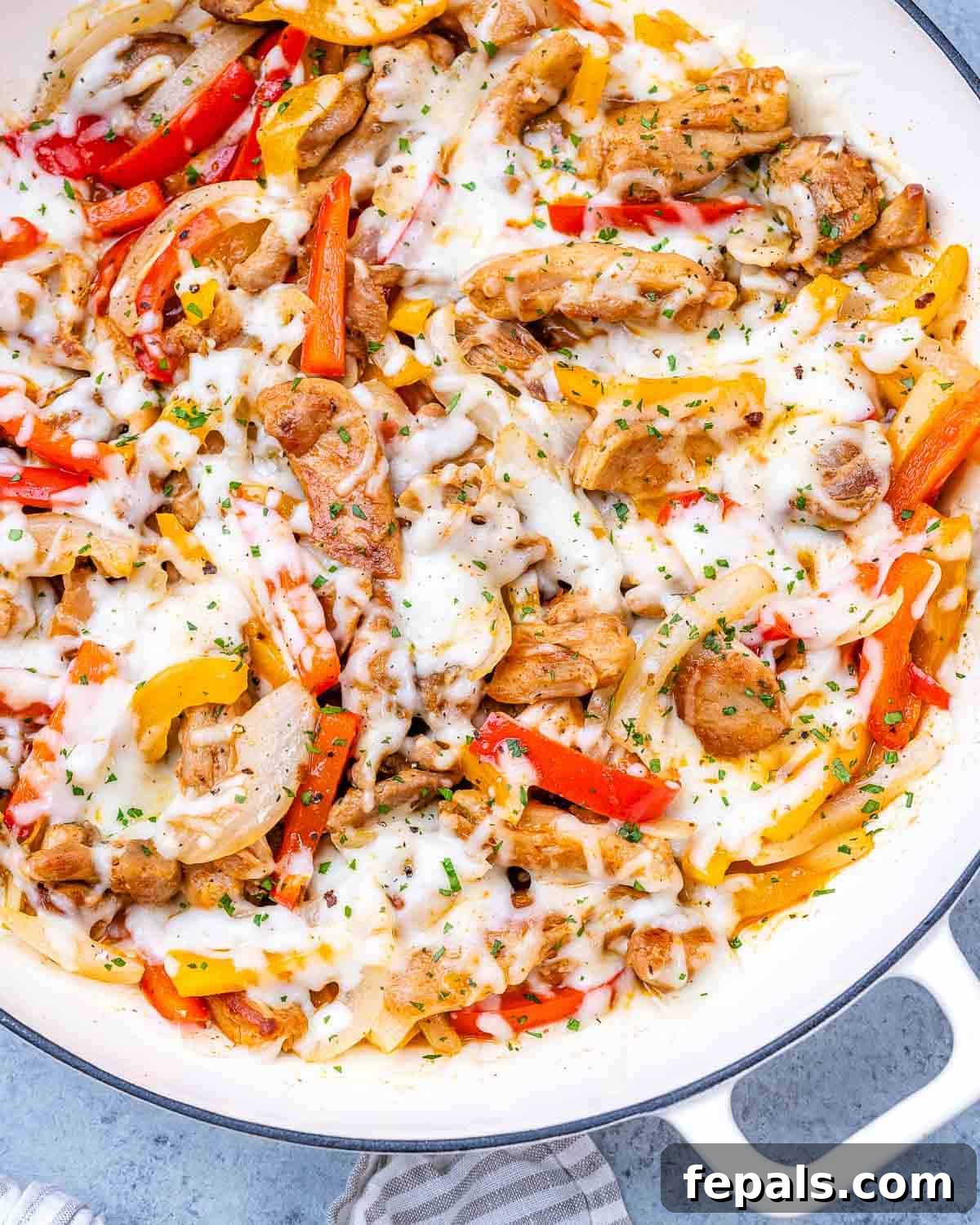 Golden Chicken Philly Melt 2 Chicken Philly Cheesesteak skillet topped with gooey melted mozzarella, sliced peppers, onions, and seasoned chicken.