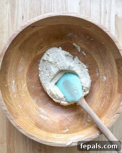 Low-Carb Almond Bagels 17 Spatula in a bowl with the bagel dough.