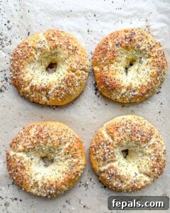 Low-Carb Almond Bagels 21 Four baked bagels on the sheet pan.