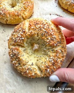 Low-Carb Almond Bagels 22 Hand holding up a single bagel