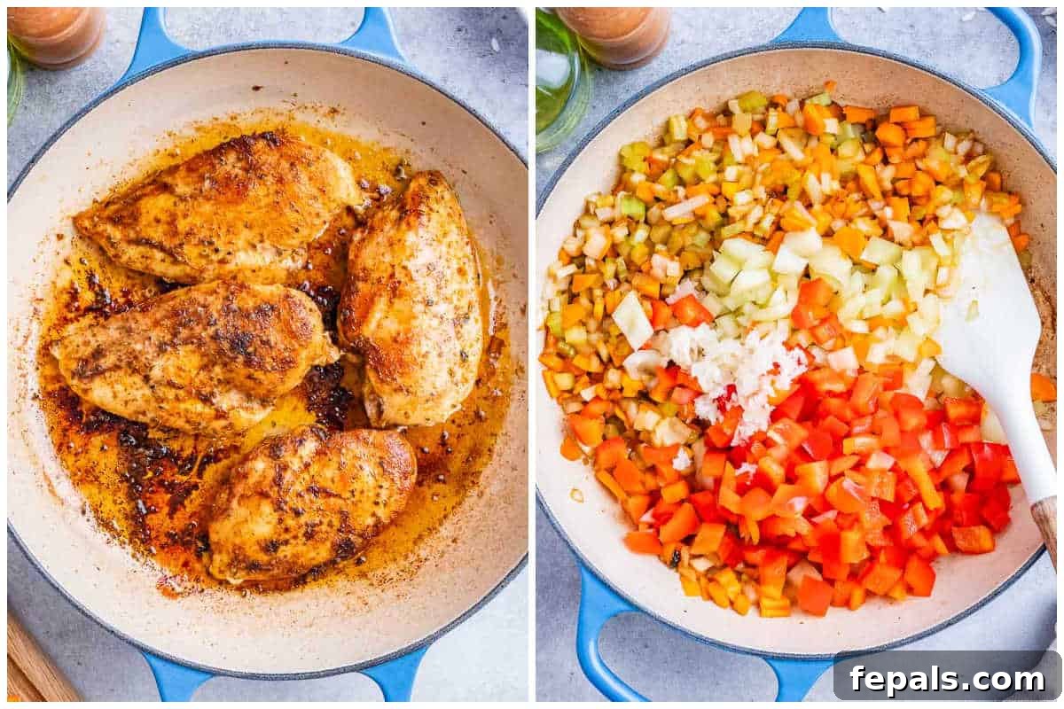 Process shot showing seasoned chicken breasts and chopped vegetables ready for cooking Spanish rice.