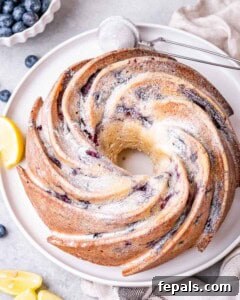 Lemon Blueberry Bliss Bundt 12 lemon bundt cake dusted with powdered sugar