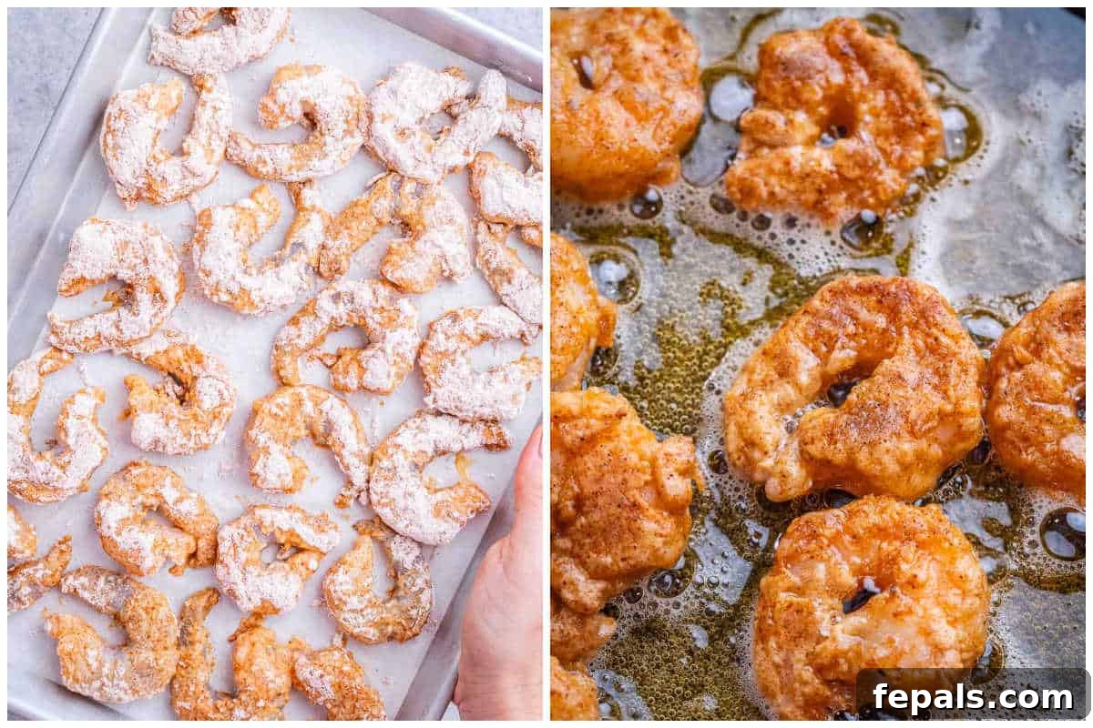 A process shot showing breaded shrimp pan-frying in a skillet.