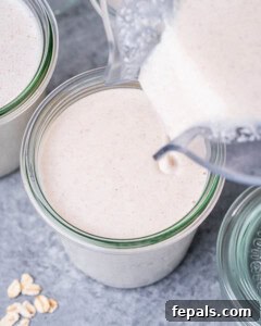 Smooth Overnight Oats 9 Pouring blended oats into a jar