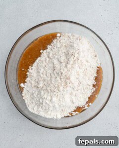oat flour mixture added over the sweet potato and egg mixture to make dough.