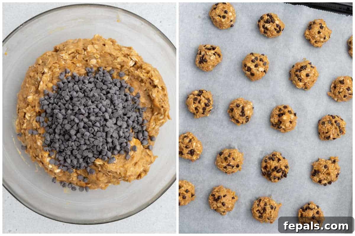 Process shot: Cookie dough is scooped onto a parchment-lined baking sheet, ready for the oven.