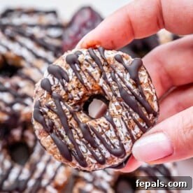 Hand holding a finished healthy Samoa cookie.