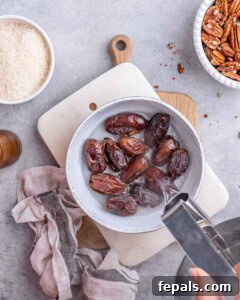 Pitted dates soaking in hot water.
