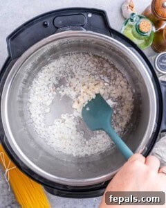 Diced sweet onion sautéing in Instant Pot