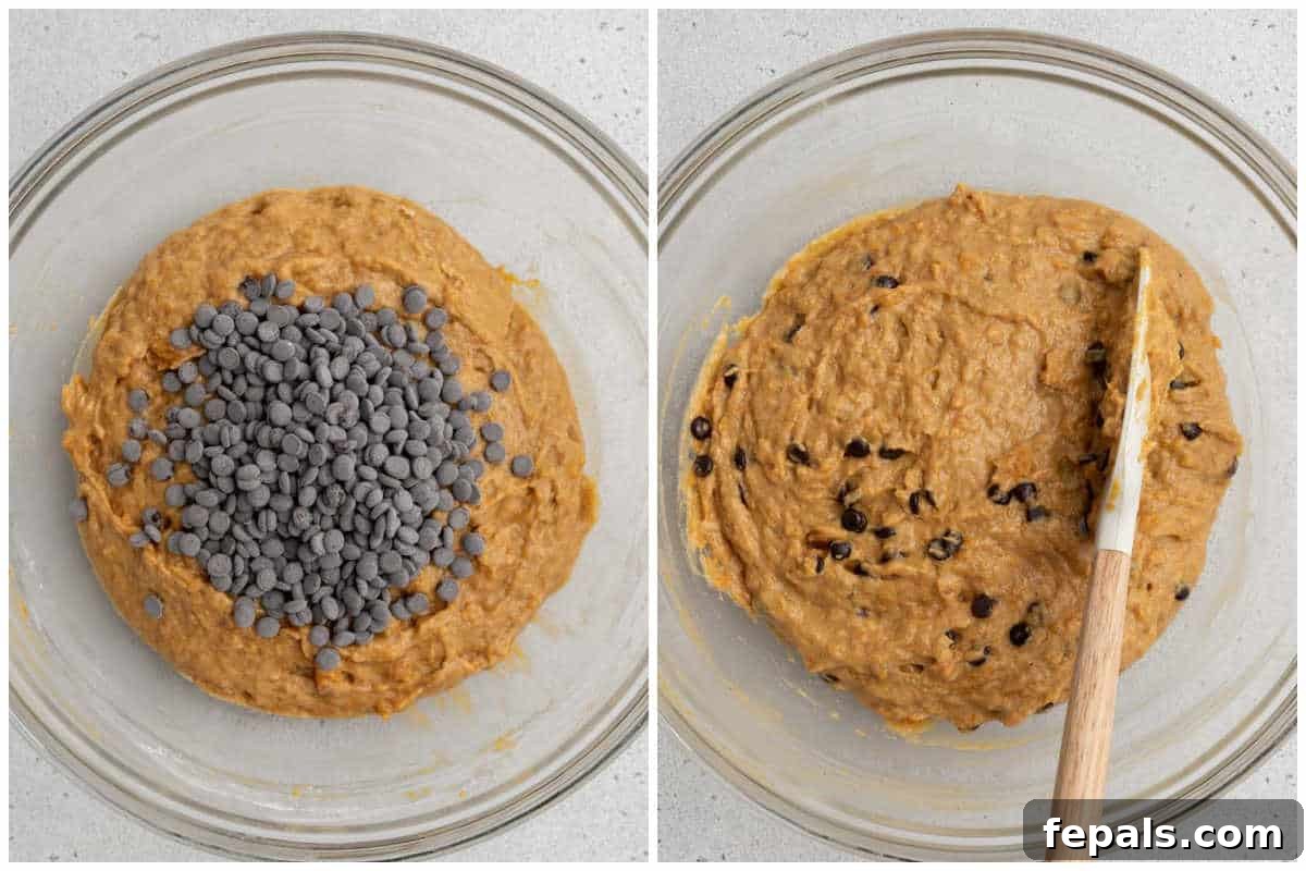 A process shot demonstrating dark chocolate chips being folded into the sweet potato bread batter in a bowl, preparing it for baking.