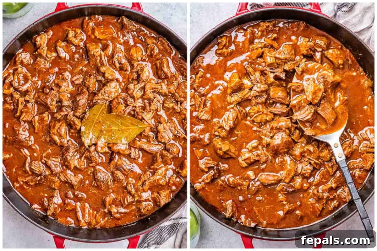 Process shot of shredding the meat in a tomato sauce in a pan.