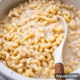mac and cheese in a bowl with spoon in bowl.