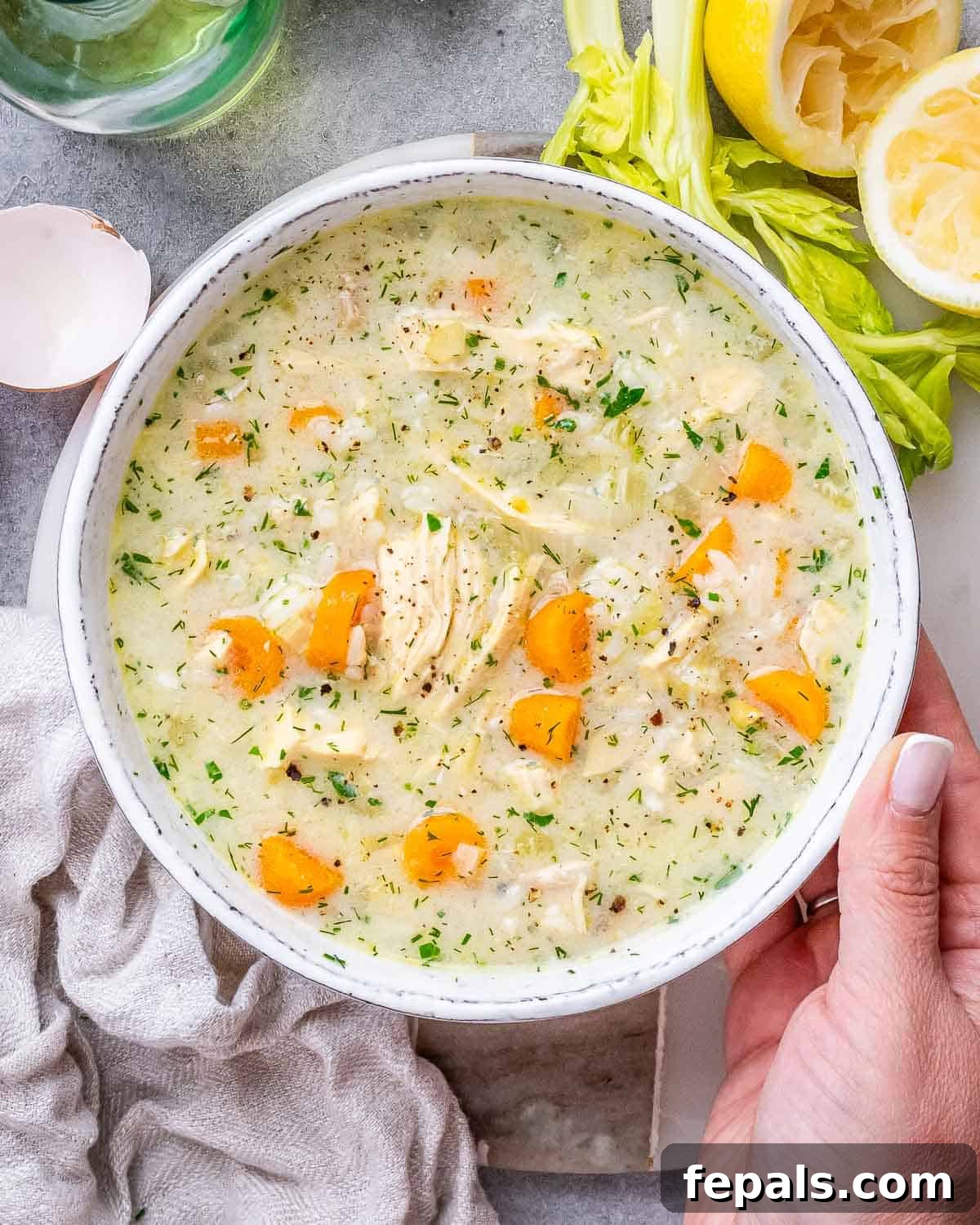 Avgolemono Soup: A Bowl of Bright Comfort 6 A pot of finished Avgolemono Soup with bright carrots, rice, and parsley, ready to be served
