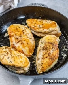 seared chicken breast in a pan.