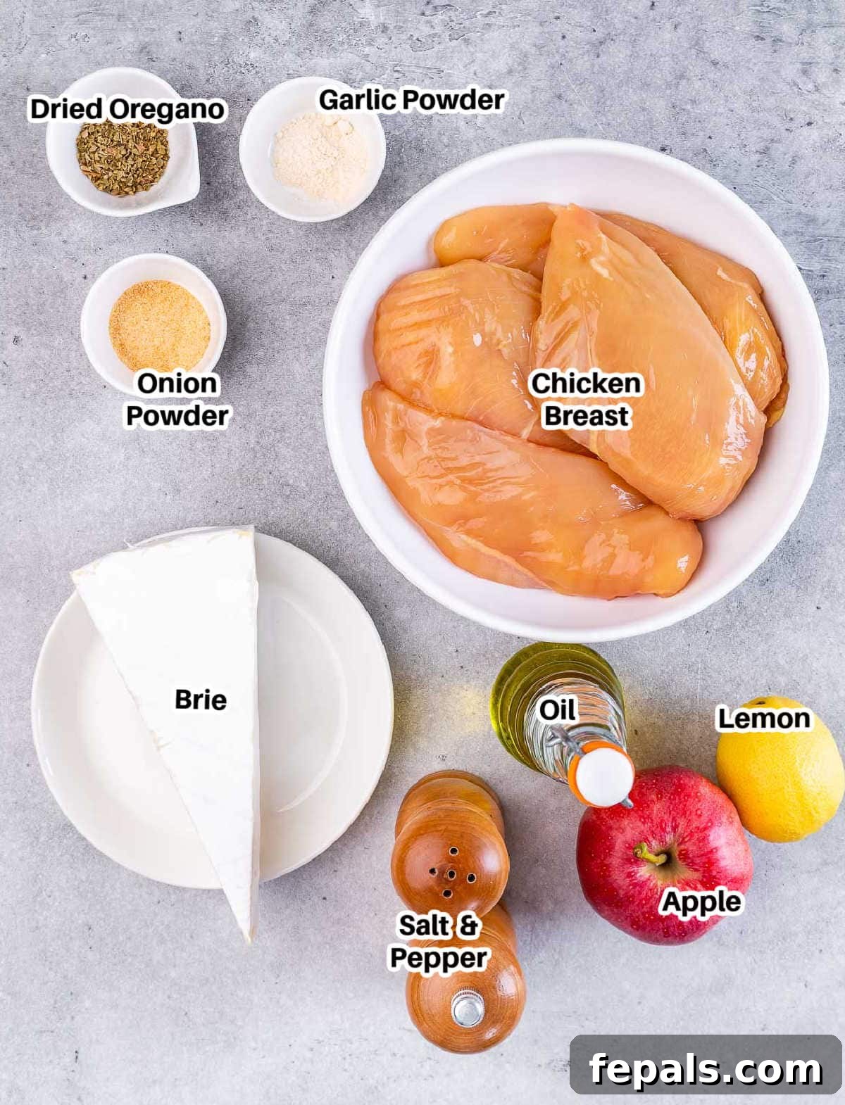 ingredients to make stuffed chicken breasts with brie and sliced apples.