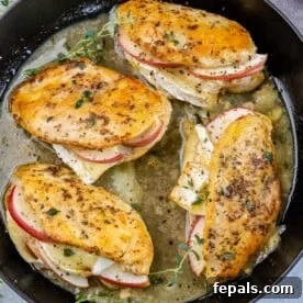 4 chicken breast in a pan stuffed with apple and brie cheese.