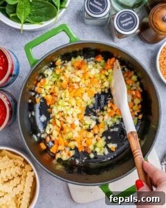 Sautéing vegetables for lasagna soup