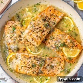 Top view salmon piccata on an orange dish