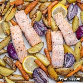 Top view baked salmon with veggies on a sheet pan