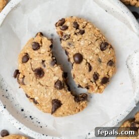 A cookie cut in half on a plate.