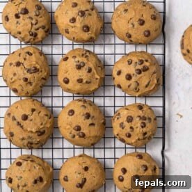 Top image of 12 baked cookies on a wire rack.
