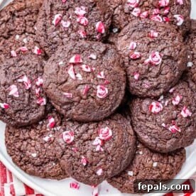 Brownie cookies on a plate topped with mint chips.
