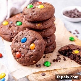 Chocolate cookies stacked with M&M's.