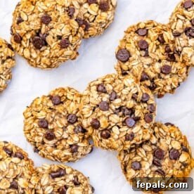 Top view of oatmeal cookies on a white sheet.