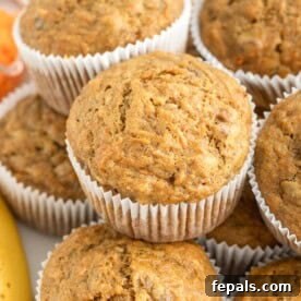 Carrot banana muffins stacked over each other.