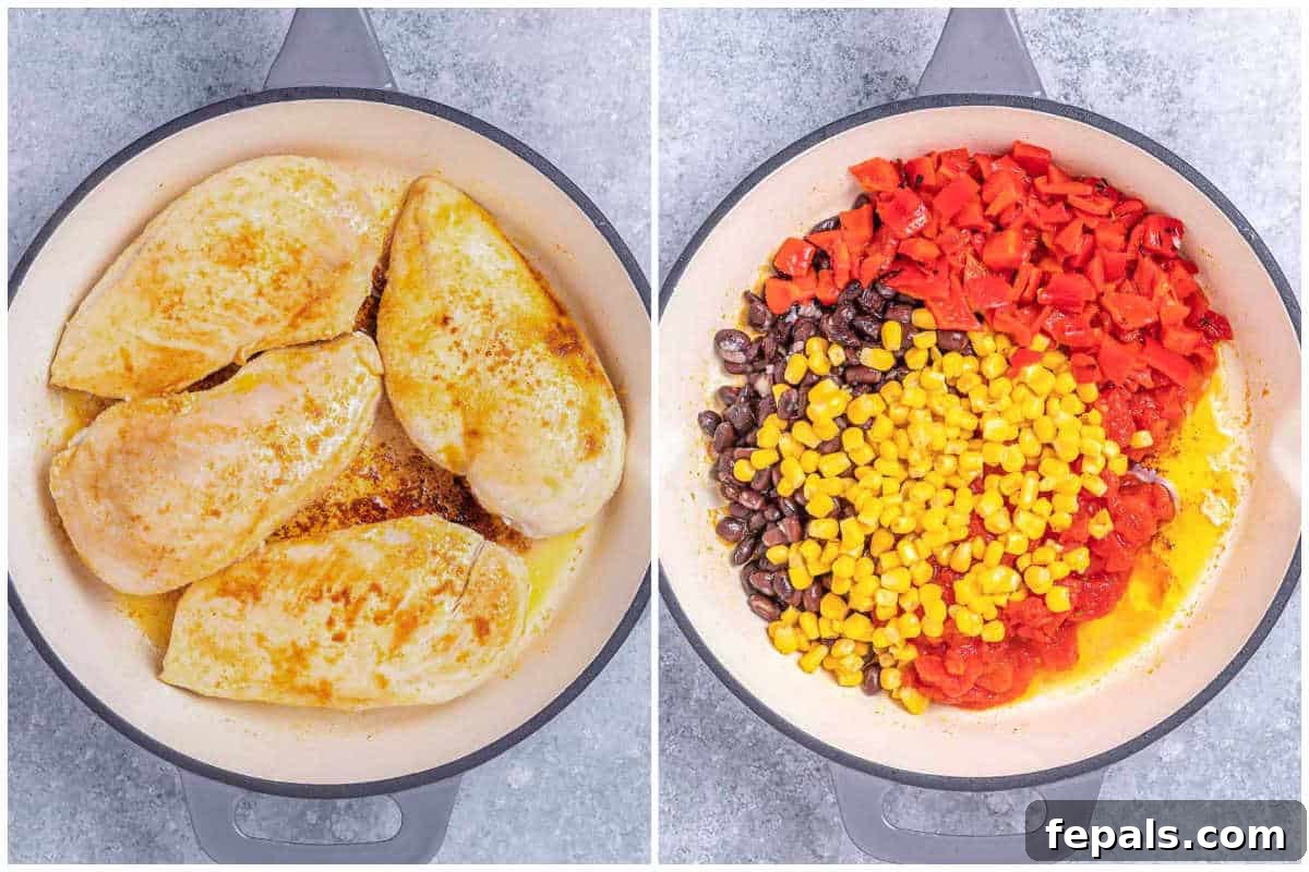 Seasoned chicken breasts searing in a hot skillet, next to a bowl of spices and olive oil.