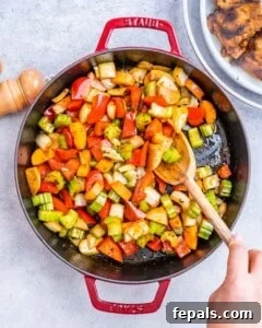 Vegetables sautéing in a skillet