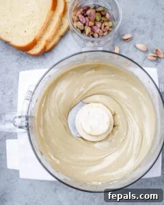 Smooth pistachio and cream cheese mixture blended in a food processor until creamy and uniform in texture.