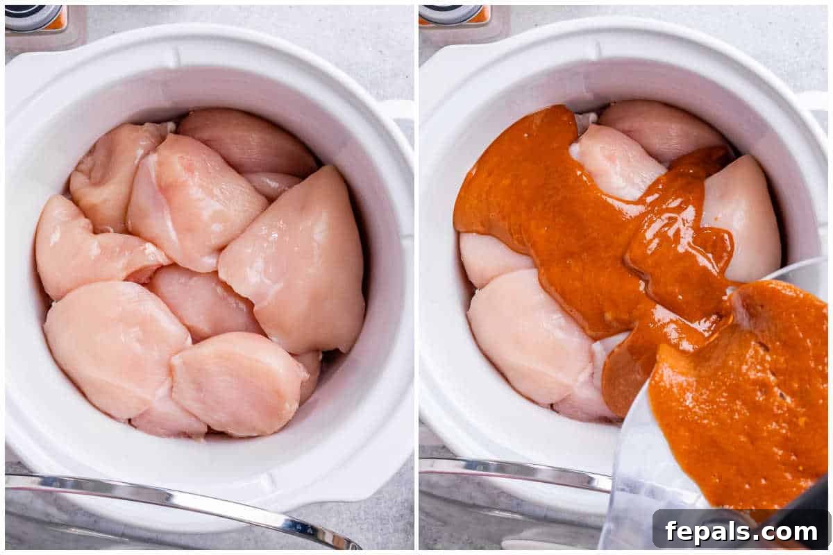 Effortless Slow Cooker BBQ Pulled Chicken 5 Raw chicken breasts, cut into large chunks, placed in the bottom of a crockpot with homemade BBQ sauce being poured generously over them.