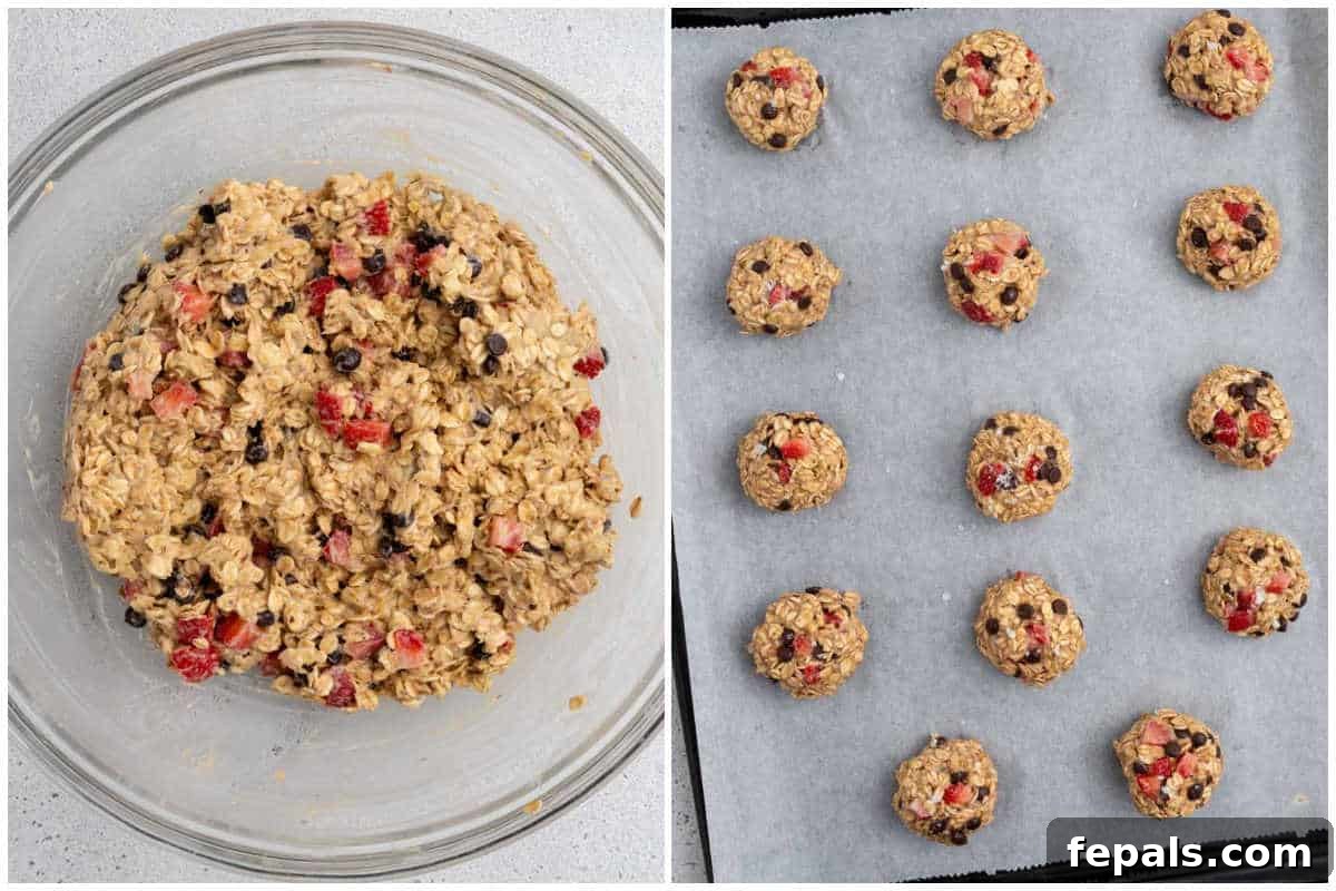 Process shot showing cookie dough balls placed on a parchment-lined baking sheet.