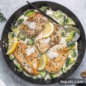 top view of seared chicken breast with a creamy dill sauce and broccoli