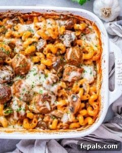 Dump and bake meatball casserole in a white casserole dish, garnished.
