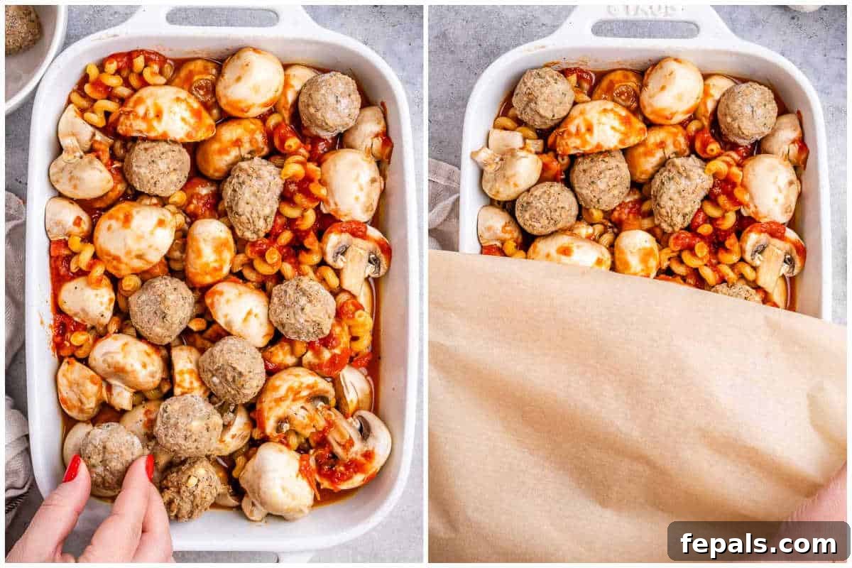 Effortless Meatball Bake 5 Process shot showing pasta, meatballs, marinara, and broth in a dish before baking.