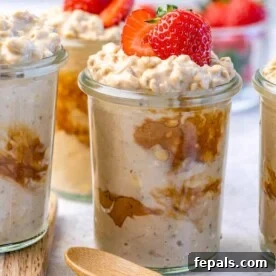 A side shot of a jar filled with rich peanut butter protein overnight oats, showcasing its creamy texture and inviting appearance.