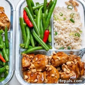 chicken bites meal prepped in a bowl with rice and a side of green beans.