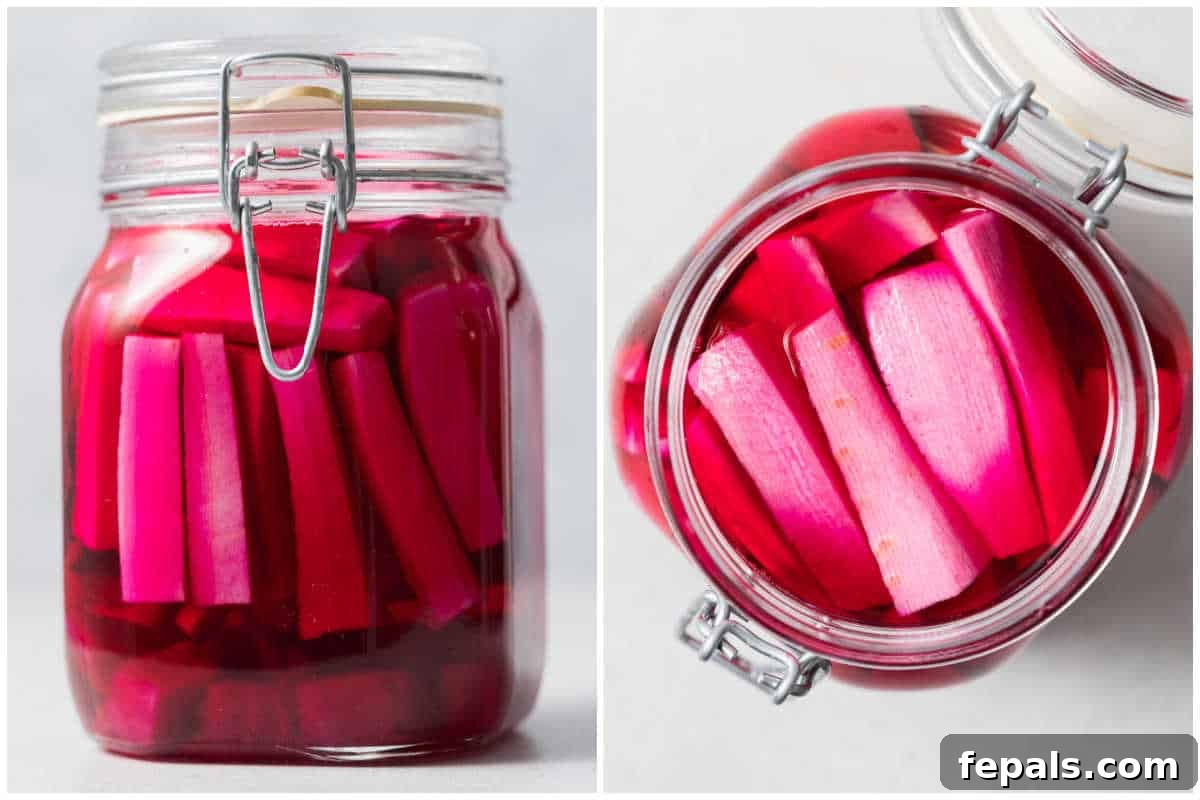 A final process shot showing the perfectly brined and pink pickled turnips secured in a glass jar.
