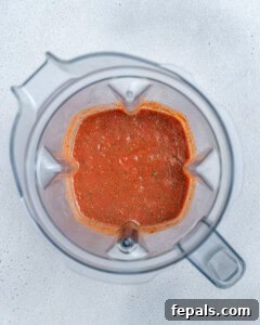 Blended pizza sauce showing a smooth texture.