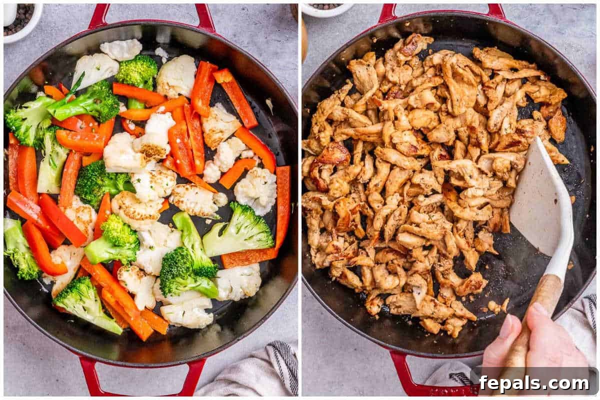 Process shot showing a red pan with cauliflower, broccoli, and red bell pepper being stir-fried to a perfect crisp-tender texture.